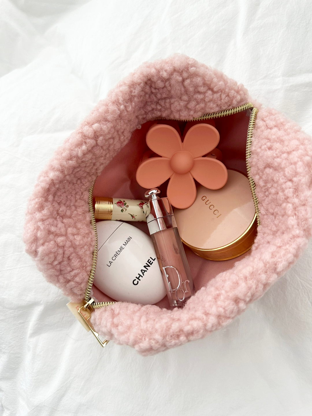 Soft pink Teddy Bear Makeup Bag with fuzzy texture and gold zipper — perfect for travel or vanity storage.