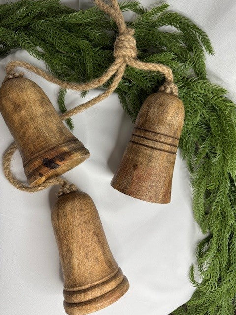 Wooden bells with rope detail beside a minimalist vase, creating a timeless look perfect for farmhouse, boho, or Scandinavian interiors.