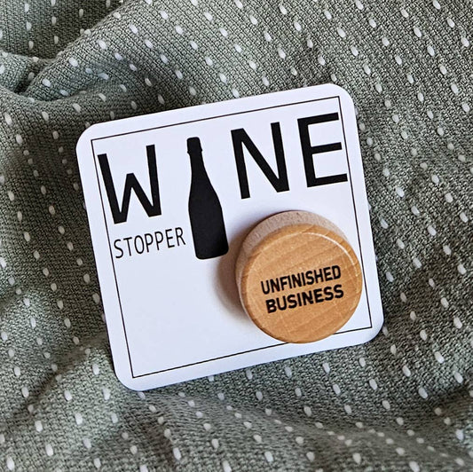 “Chic bottle stopper featuring engraved ‘Unfinished Business’ text for stylish entertaining
